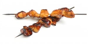 Teriyaki chicken kebabs on wooden skewers.